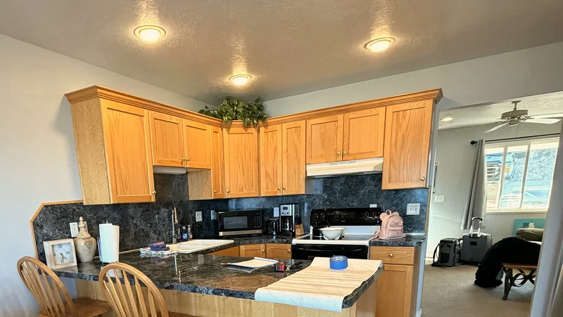 Kitchen with breakfast bar and stools at Bear Lake Lookout condo