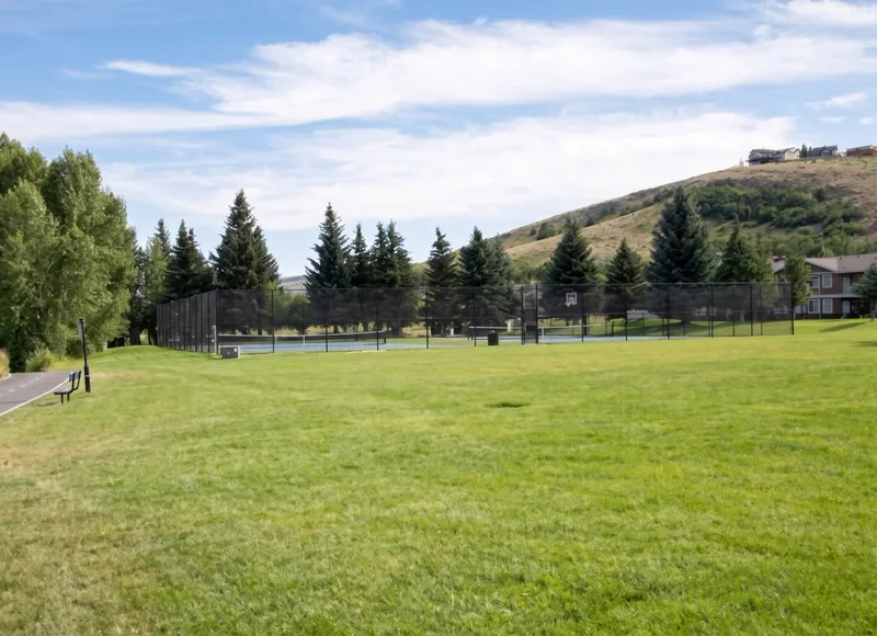 Green space and the paved path at Harbor Village